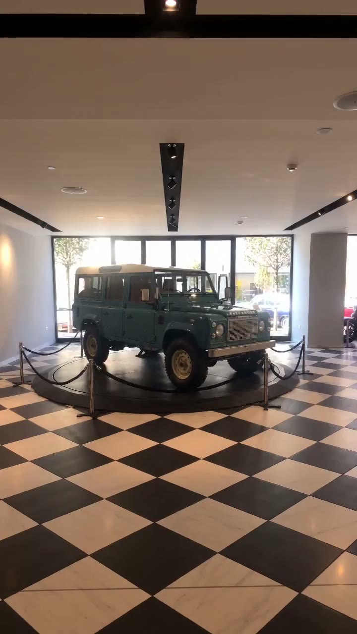 A Land Rover Defender on a roped-off YılPlat platform